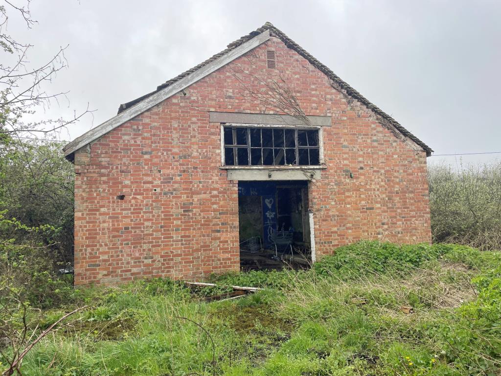 Lot: 18 - 13 PARCELS OF LAND WITH POTENTIAL IN STRATEGIC LOCATION - view of detached former brick dairy
